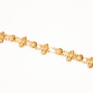 Soccer braclet with cleats and soccerballs